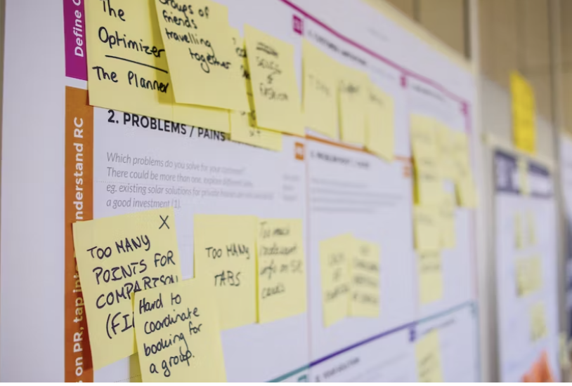 post it notes on a bulletin board